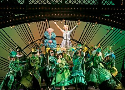 GREEN IS IN. Ozians cheer for Glinda the Good in one of the bigger production numbers of the show. (credit to the owner of this image)